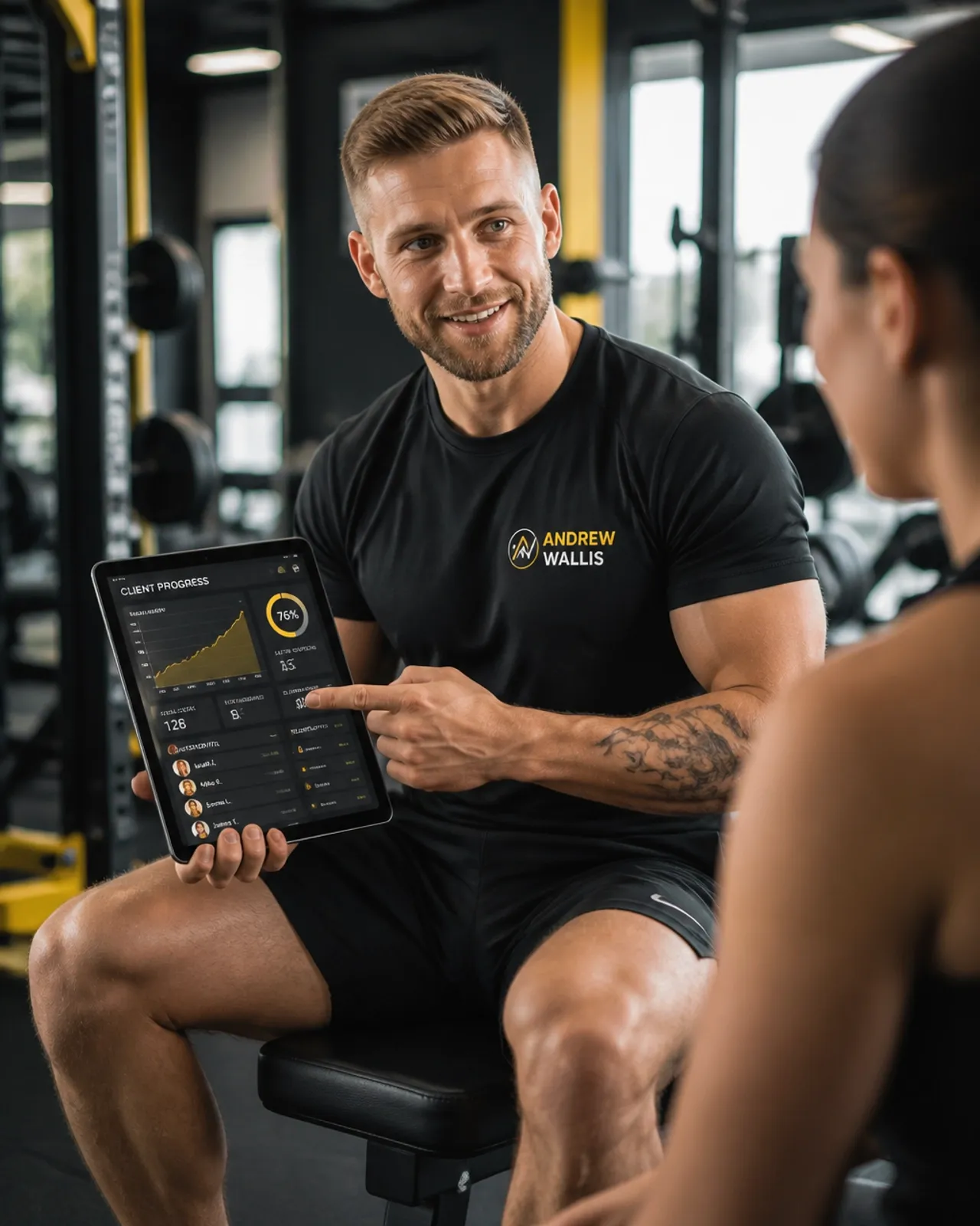 Trainer using a tablet to manage gym leads and growth metrics
